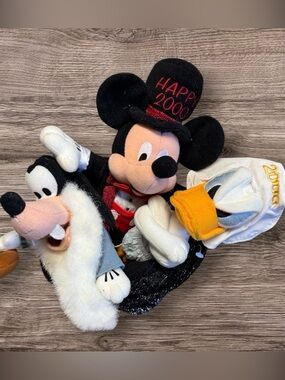 This is a vintage Disney Store "Happy 2000" bean bag plush set